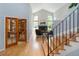 Elegant staircase leading to a cozy living area with a fireplace and natural light at 2345 Spotswood Pl, Boulder, CO 80304