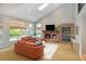 Inviting living room features vaulted ceilings, a fireplace, and many windows for natural light at 2345 Spotswood Pl, Boulder, CO 80304