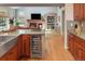Open-concept living area with hardwood floors, brick fireplace, and built-in shelving at 2345 Spotswood Pl, Boulder, CO 80304