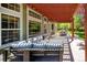 Covered outdoor patio with wooden pergola, outdoor seating area, and retractable awning is perfect for entertaining at 2345 Spotswood Pl, Boulder, CO 80304