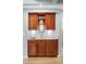 Elegant wet bar with custom cabinetry, granite countertop, and stylish lighting at 2345 Spotswood Pl, Boulder, CO 80304