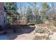 Backyard with a trampoline, landscaping, and a stone path, perfect for outdoor activities at 2345 Spotswood Pl, Boulder, CO 80304