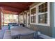 This backyard patio features a dark wood pergola and large outdoor dining table at 2345 Spotswood Pl, Boulder, CO 80304