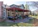 Inviting backyard patio featuring an outdoor seating area, pergola, and lush greenery at 2345 Spotswood Pl, Boulder, CO 80304