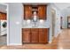 Charming wet bar area with custom wood cabinetry and granite countertops, perfect for entertaining at 2345 Spotswood Pl, Boulder, CO 80304