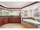 Luxurious bathroom with a soaking tub, wood cabinets, and a granite countertop at 2345 Spotswood Pl, Boulder, CO 80304