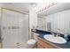Bright bathroom with glass shower and a modern-style vanity with ample counter space at 2345 Spotswood Pl, Boulder, CO 80304