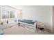 Bedroom featuring a window, white bed, colorful decals and soft carpet at 2345 Spotswood Pl, Boulder, CO 80304