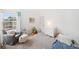 Bright bedroom with a cozy chair and a large window letting in natural light at 2345 Spotswood Pl, Boulder, CO 80304