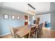 Elegant dining room with a long wooden table and stylish pendant lighting at 2345 Spotswood Pl, Boulder, CO 80304