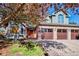 Charming brick home featuring a three-car garage and well-maintained landscaping with mature trees at 2345 Spotswood Pl, Boulder, CO 80304