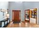 Elegant foyer boasts hardwood floors, high ceilings, and a decorative table, creating a welcoming entrance at 2345 Spotswood Pl, Boulder, CO 80304