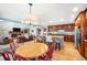 Open-concept kitchen and living area, showcasing granite countertops, a breakfast bar, and a fireplace at 2345 Spotswood Pl, Boulder, CO 80304