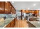 Spacious kitchen with stainless steel appliances, granite countertops, hardwood floors, and ample cabinet space at 2345 Spotswood Pl, Boulder, CO 80304