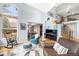 Bright living room featuring soaring ceilings, hardwood floors, and a grand piano at 2345 Spotswood Pl, Boulder, CO 80304