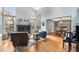 Bright living room featuring a fireplace, large windows, hardwood floors, and an open layout at 2345 Spotswood Pl, Boulder, CO 80304
