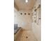 Bathroom featuring a tiled shower with a glass door, multiple shower heads, and granite countertop at 2345 Spotswood Pl, Boulder, CO 80304
