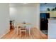 Dining area with adjacent black refrigerator and view of kitchen at 8369 S Independence Cir # 205, Littleton, CO 80128