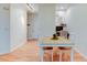 Dining space with wood floors and a view into the office at 8369 S Independence Cir # 205, Littleton, CO 80128