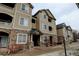 Close up view of a lovely condominium complex, showing the building number and architecture at 8369 S Independence Cir # 205, Littleton, CO 80128