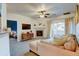 Cozy living room featuring a fireplace, comfortable seating, and access to a balcony at 8369 S Independence Cir # 205, Littleton, CO 80128