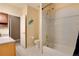 Bathroom featuring a shower and tub combination, toilet, and vanity sink, and tiled walls at 740 W Lancers Ct, Monument, CO 80132