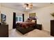 Tranquil bedroom with a ceiling fan, cozy bed, and stylish decor, creating a relaxing atmosphere at 740 W Lancers Ct, Monument, CO 80132