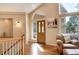 Welcoming foyer with hardwood floors, arched doorway, large windows, and ample natural light at 740 W Lancers Ct, Monument, CO 80132