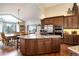 Well-equipped kitchen featuring a large island, stainless steel appliances, and custom cabinetry at 740 W Lancers Ct, Monument, CO 80132