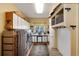 Bright laundry room with stainless steel washer and dryer, ample storage cabinets, and a convenient folding area at 740 W Lancers Ct, Monument, CO 80132