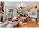 Inviting living room featuring hardwood floors, vaulted ceilings, and comfortable leather seating at 740 W Lancers Ct, Monument, CO 80132