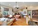 Spacious living room with vaulted ceilings, hardwood floors, and an open floor plan at 740 W Lancers Ct, Monument, CO 80132