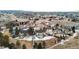 Aerial view of the house with a spacious backyard and surrounding neighborhood at 10039 Heatherwood Pl, Highlands Ranch, CO 80126