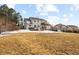 Expansive backyard with grassy hill and multilevel deck; perfect for entertaining at 10039 Heatherwood Pl, Highlands Ranch, CO 80126