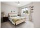 Comfortable bedroom showcases natural light, a cozy bed, and a soothing color scheme at 10039 Heatherwood Pl, Highlands Ranch, CO 80126