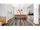 Formal dining area featuring a long wooden table, seating for ten, and chic decorative elements at 10039 Heatherwood Pl, Highlands Ranch, CO 80126