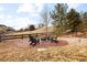 Outdoor fire pit area with Adirondack chairs and mature landscaping at 10039 Heatherwood Pl, Highlands Ranch, CO 80126