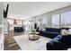 Open concept living room and kitchen featuring a large sectional sofa at 10039 Heatherwood Pl, Highlands Ranch, CO 80126