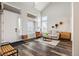 Bright living space with vaulted ceilings, modern furnishings, and plenty of natural light at 10039 Heatherwood Pl, Highlands Ranch, CO 80126