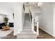 Carpeted staircase leading to the upper level of the home, with open view at 10039 Heatherwood Pl, Highlands Ranch, CO 80126