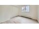 Empty bedroom with hardwood floors, closet, and bright window at 1117 Elysian Field Dr # A, Lafayette, CO 80026