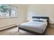 Cozy bedroom featuring a comfortable bed, side tables, and a bright window at 1117 Elysian Field Dr # A, Lafayette, CO 80026