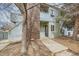 Inviting two-story condo featuring a brick facade and lush landscaping at 1117 Elysian Field Dr # A, Lafayette, CO 80026