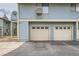 Exterior of building with garage space and parking at 1117 Elysian Field Dr # A, Lafayette, CO 80026