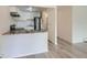 Kitchen with granite countertops, stainless appliances, white cabinets, and neutral paint at 1117 Elysian Field Dr # A, Lafayette, CO 80026