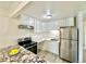 Well-lit kitchen with white cabinets, stainless steel appliances, and granite countertops at 1117 Elysian Field Dr # A, Lafayette, CO 80026
