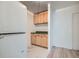 Laundry room with washer and dryer and built in wood cabinets at 1117 Elysian Field Dr # A, Lafayette, CO 80026