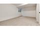 Empty basement with neutral carpet, a single window and white walls at 8543 Redstone St, Highlands Ranch, CO 80126