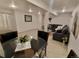 Basement living area with neutral carpet, a comfortable couch, and a glass table for an elegant touch at 8543 Redstone St, Highlands Ranch, CO 80126