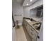 Bathroom with granite countertop, modern fixtures, and a shower with glass door at 8543 Redstone St, Highlands Ranch, CO 80126